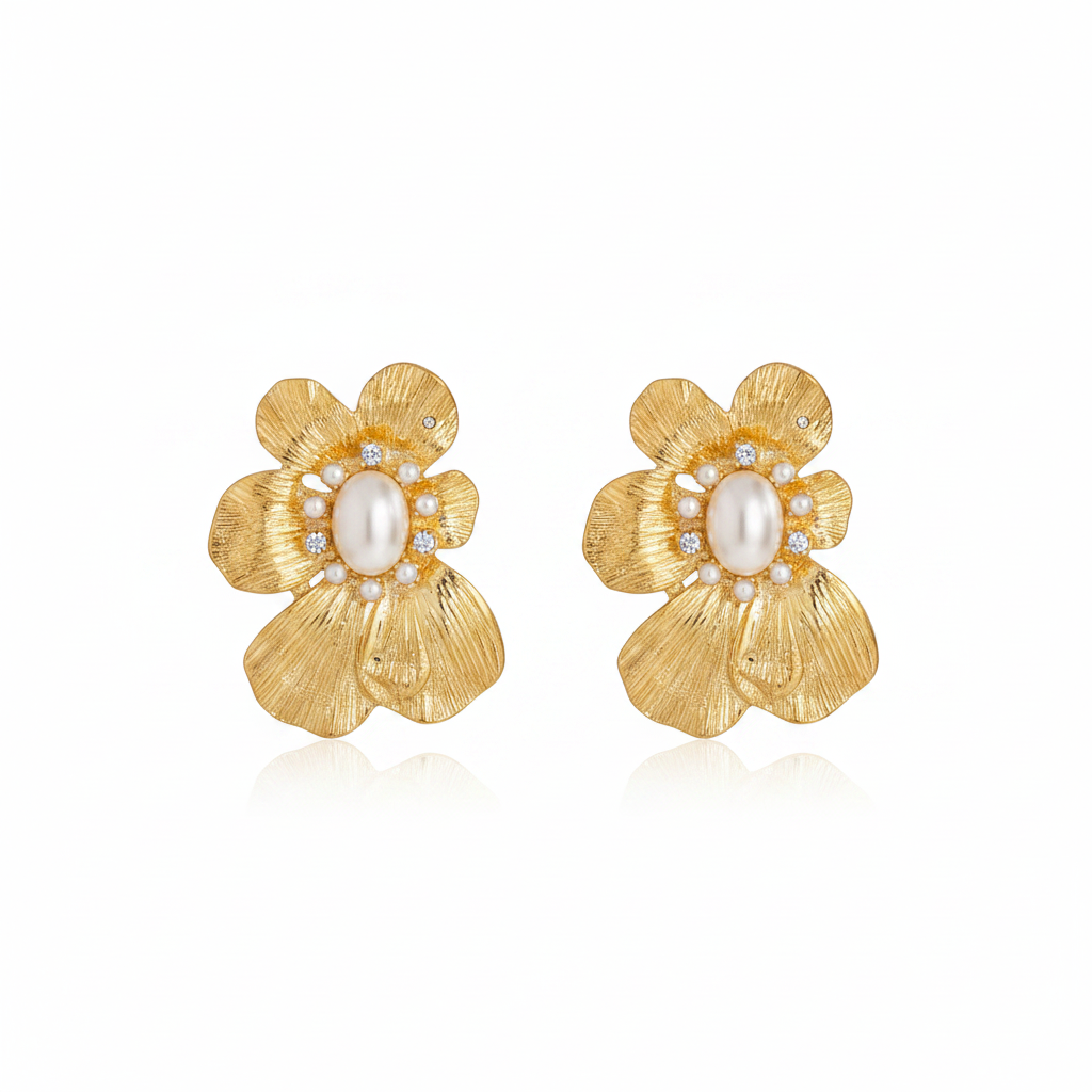 Gold flower-shaped earring with a pearl center on a white background